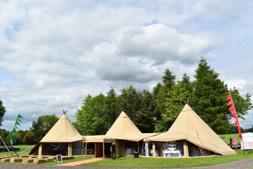 tipi formation with beige canvas